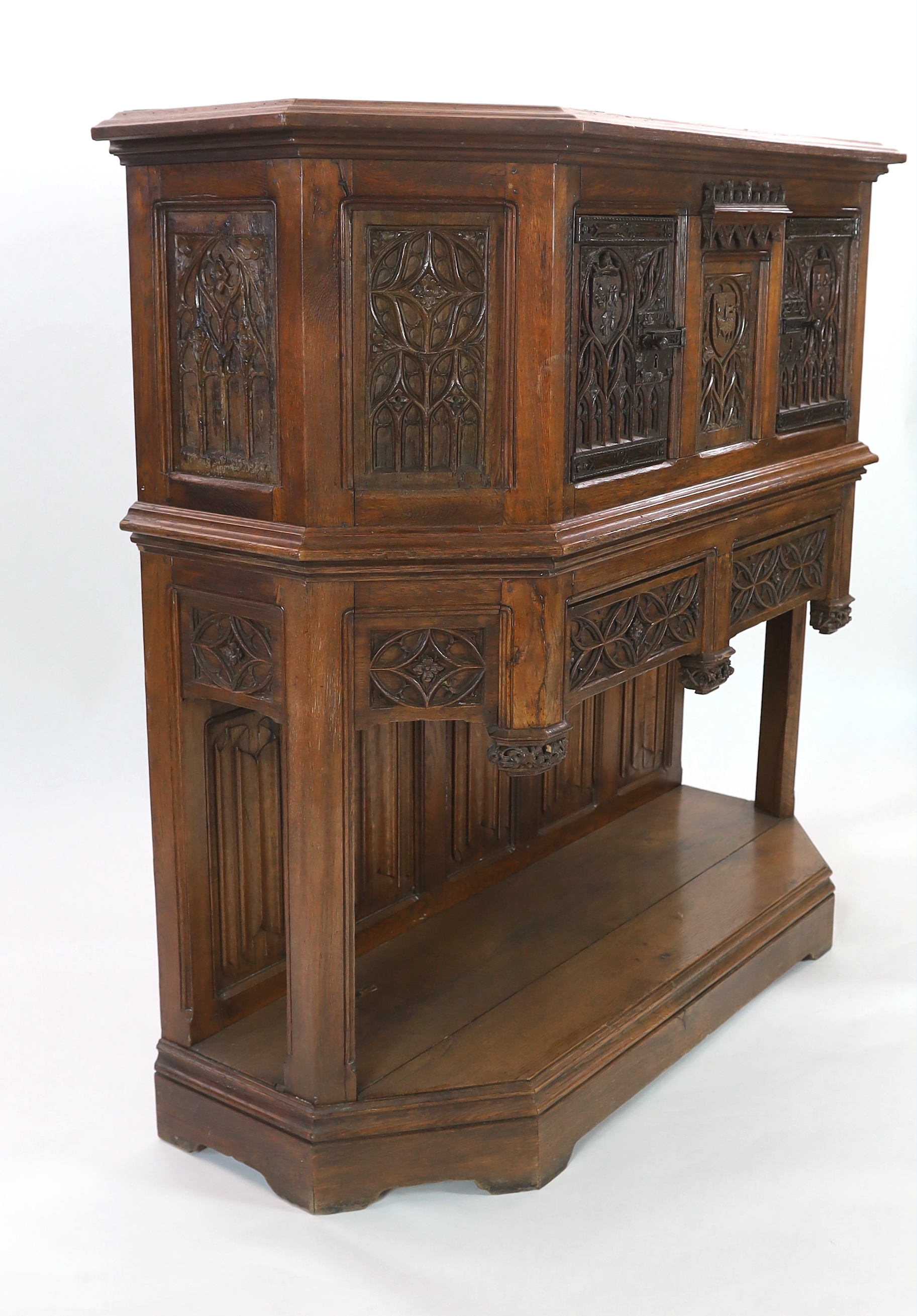 An antique oak dresser, based on a 15th century French gothic model and very similar to an example in the Wallace Collection